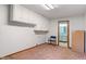Additional room with wall-mounted cabinets and view into an adjacent bathroom at 11415 Central E Dr, Carmel, IN 46032