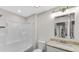 Bright bathroom boasts a shower-tub combo, granite vanity, and ample lighting at 11436 Mossy Ct # 101, Fishers, IN 46037