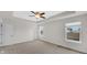 Spacious bedroom with tray ceiling, carpet floors, and bright windows at 11436 Mossy Ct # 101, Fishers, IN 46037