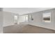 Spacious room features large windows, neutral walls, and carpet floors at 11436 Mossy Ct # 101, Fishers, IN 46037