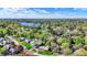 The aerial view reveals the home's location in a neighborhood near a lake at 11626 Forest Dr, Carmel, IN 46033