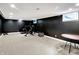 Spacious finished basement with black paneling, carpeting and recessed lighting at 11626 Forest Dr, Carmel, IN 46033