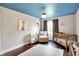 Charming Bedroom with a blue ceiling with stars, hardwood floors, and ample light at 11626 Forest Dr, Carmel, IN 46033
