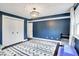 Stylish bedroom with navy walls, white trim, carpet, and ample closet space at 11626 Forest Dr, Carmel, IN 46033