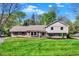 Charming two-story home with landscaped yard, blue shutters, and a well-manicured lawn at 11626 Forest Dr, Carmel, IN 46033