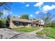 Beautiful home exterior with lush front lawn and blue sky background at 11626 Forest Dr, Carmel, IN 46033