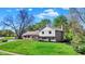 Beautiful home exterior with manicured lawn and lovely landscaping at 11626 Forest Dr, Carmel, IN 46033