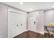 Inviting foyer with beautiful doors, hardwood flooring, and stylish accents at 11626 Forest Dr, Carmel, IN 46033