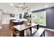 Open concept kitchen and dining space, featuring navy cabinets and stainless steel appliances at 11626 Forest Dr, Carmel, IN 46033