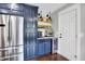 Updated kitchen with stainless steel refrigerator, wine cooler, and plenty of cabinet space at 11626 Forest Dr, Carmel, IN 46033