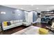 Cozy living room with hardwood floors, sectional sofa, area rug, and built-in shelving at 11626 Forest Dr, Carmel, IN 46033