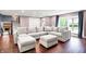 Bright living room featuring a cozy sectional sofa, hardwood floors, and lots of natural light at 11626 Forest Dr, Carmel, IN 46033