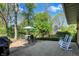 Inviting patio with ample seating, an umbrella, and a grill, ideal for outdoor enjoyment at 11626 Forest Dr, Carmel, IN 46033