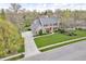 Beautiful aerial view showcasing the home, driveway, and surrounding greenery at 11642 Old Stone Dr, Indianapolis, IN 46236