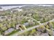 Picturesque neighborhood with lush greenery, winding roads, and a view of a lake in the distance at 11642 Old Stone Dr, Indianapolis, IN 46236