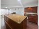 Finished basement bar area with granite countertop and wood cabinets and trim at 11642 Old Stone Dr, Indianapolis, IN 46236