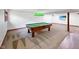 Finished basement with a pool table, entertainment area, and great lighting at 11642 Old Stone Dr, Indianapolis, IN 46236