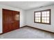 Charming bedroom with a window, featuring a spacious closet for all your storage needs at 11642 Old Stone Dr, Indianapolis, IN 46236
