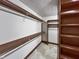 Walk-in closet with built-in shelving, providing organized storage for clothing and accessories at 11642 Old Stone Dr, Indianapolis, IN 46236