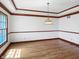 Open dining room with hardwood floors and a stylish chandelier at 11642 Old Stone Dr, Indianapolis, IN 46236