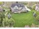 Charming two-story home with a well-manicured lawn, porch, and a mix of brick and siding at 11642 Old Stone Dr, Indianapolis, IN 46236