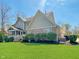 Charming home with a well-maintained lawn and a brick facade at 11642 Old Stone Dr, Indianapolis, IN 46236