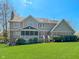 Two story home with a large back yard and a screened in porch at 11642 Old Stone Dr, Indianapolis, IN 46236