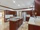 Well-equipped kitchen with granite countertops, stainless steel appliances, and custom cabinetry at 11642 Old Stone Dr, Indianapolis, IN 46236