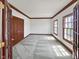 Bright living room with neutral carpet and wood trim, featuring natural light at 11642 Old Stone Dr, Indianapolis, IN 46236