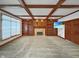 Cozy living room with a brick fireplace, built-in bookshelves, and a modern TV at 11642 Old Stone Dr, Indianapolis, IN 46236
