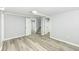 Finished basement featuring gray walls, recessed lighting and gray flooring and an open doorway to another room at 1216 N Whittier Pl, Indianapolis, IN 46219