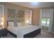 Inviting bedroom with natural light, a comfortable bed, and elegant decor at 12214 Cold Stream Rd, Noblesville, IN 46060