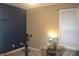 Spare bedroom with half painted wall and a stationary bike, perfect for an exercise room or private relaxation at 12214 Cold Stream Rd, Noblesville, IN 46060