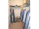 Organized walk-in closet with hanging clothes and shelving, perfect for storage and keeping your wardrobe tidy at 12214 Cold Stream Rd, Noblesville, IN 46060