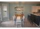 Charming dining area features a stylish table, seating for six, and decor shelving at 12214 Cold Stream Rd, Noblesville, IN 46060