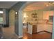 Bright and airy kitchen featuring stainless steel appliances, white cabinets and hardwood floors at 12214 Cold Stream Rd, Noblesville, IN 46060
