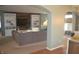Open-concept living space featuring built-in shelving, a large couch, and stylish decor at 12214 Cold Stream Rd, Noblesville, IN 46060