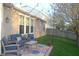 Cozy patio area is furnished with comfortable seating, a colorful rug, and string lights at 12214 Cold Stream Rd, Noblesville, IN 46060