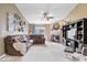 Large living room featuring a fireplace, ceiling fan, and comfortable seating at 123 Thistlewood Dr, Greenfield, IN 46140