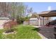 The backyard features a fenced yard, a covered patio and a small storage shed at 132 Thistlewood Dr, Greenfield, IN 46140