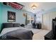 This cozy bedroom features playful wall decor, comfortable bed, and desk, perfect for relaxing or studying at 132 Thistlewood Dr, Greenfield, IN 46140