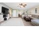 Inviting living area with a cozy fireplace feature, and comfortable sectional sofa at 132 Thistlewood Dr, Greenfield, IN 46140