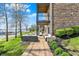 Lake view featuring outdoor seating, lake access and lush landscaping from patio on a bright sunny day at 13797 E Southshore Dr, Fishers, IN 46037