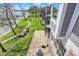 Overhead view of backyard showing winding path, lush lawn, multiple patios and lake access on a bright sunny day at 13797 E Southshore Dr, Fishers, IN 46037