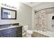Bathroom with granite countertops, stylish mirror, and shower-tub combination at 13797 E Southshore Dr, Fishers, IN 46037