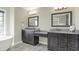 Dual sinks and vanities in bathroom with large window and view of a free standing tub at 13797 E Southshore Dr, Fishers, IN 46037
