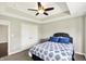 Bedroom featuring blue accents and tray ceiling at 13797 E Southshore Dr, Fishers, IN 46037