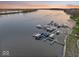 An aerial view of community boat docks on the water, providing convenient access for residents, perfect for lake living at 13797 E Southshore Dr, Fishers, IN 46037