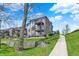 Three-story building showing patios, lawn and sidewalk at 13797 E Southshore Dr, Fishers, IN 46037