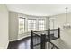 Upstairs hallway with bay window, dark wood floors, decorative light, and neutral paint at 13797 E Southshore Dr, Fishers, IN 46037